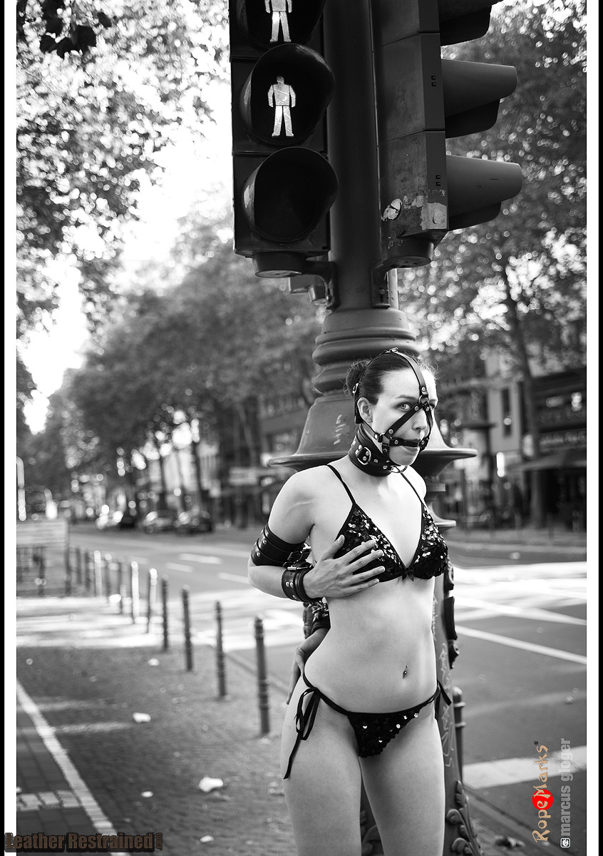 Dutch Dame restrained in leather on the streets of Cologne, Germany.